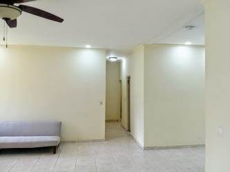 Interior hallway and living room with split AC and tile floors in Residencial Howard Panama Pacifico