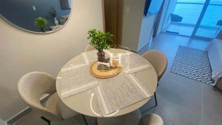 Infinity swimming pool with ocean view and lounge deck at PH El Palmar Beach Condos in Panama