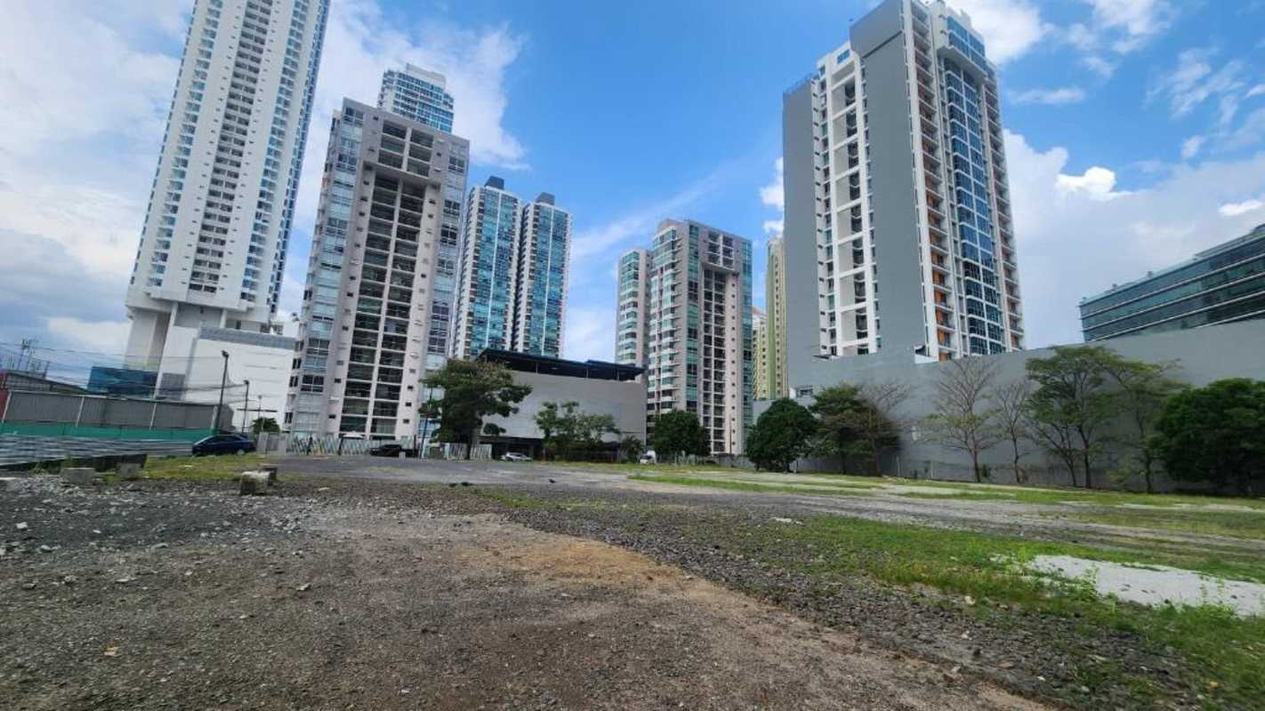 Fenced vacant lot surrounded by skyscrapers Costa del Este Panama City for commercial lease
