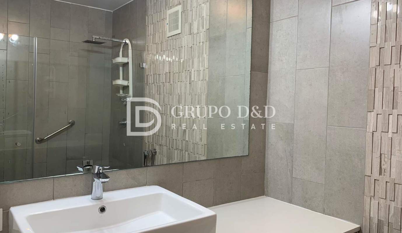 Bathroom with glass-enclosed shower, mosaic accents at Velure El Cangrejo