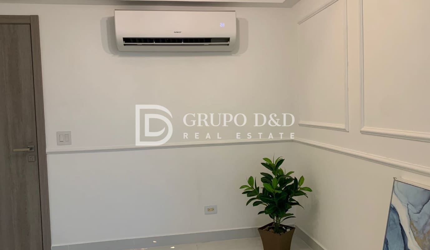 White interior flex room with plant and AC in Velure apartment El Cangrejo