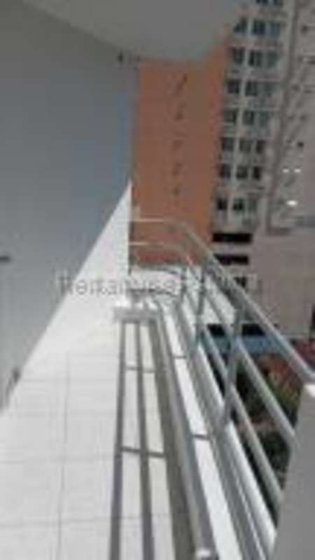 Living and dining room area in apartment at PH Torres de San Francisco Panama with laminate flooring