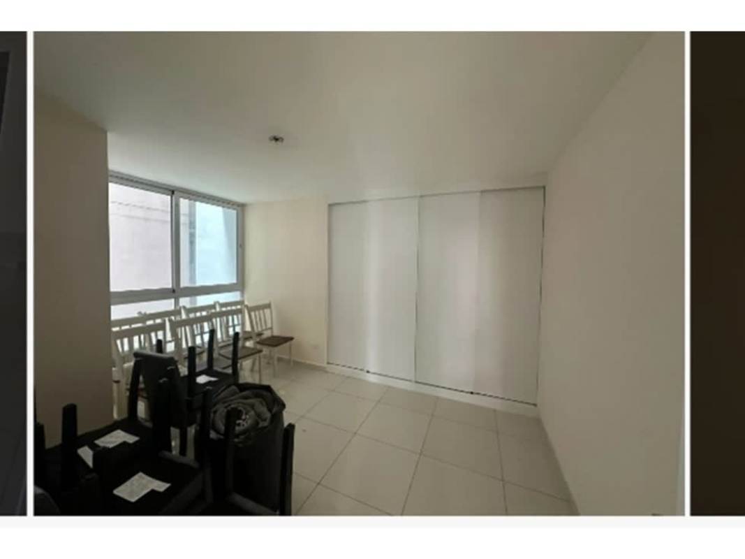 Minimalist master bedroom with large window, AC, and closet PH Bela Vita Avenida Balboa