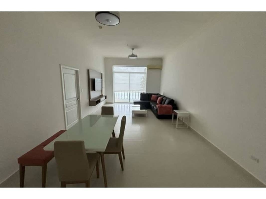 Spacious living dining room with balcony access and ocean views in Vista del Mar Panama