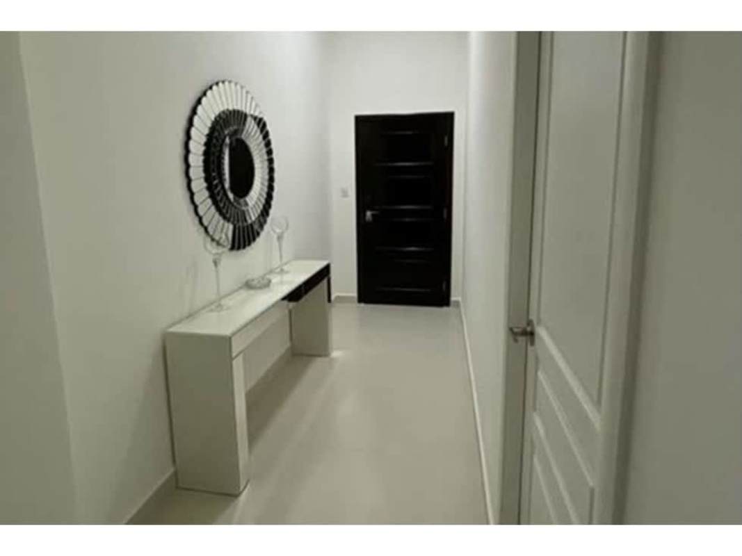 Modern hallway with mirror and console in PH Vista del Mar Panama City apartment for rent