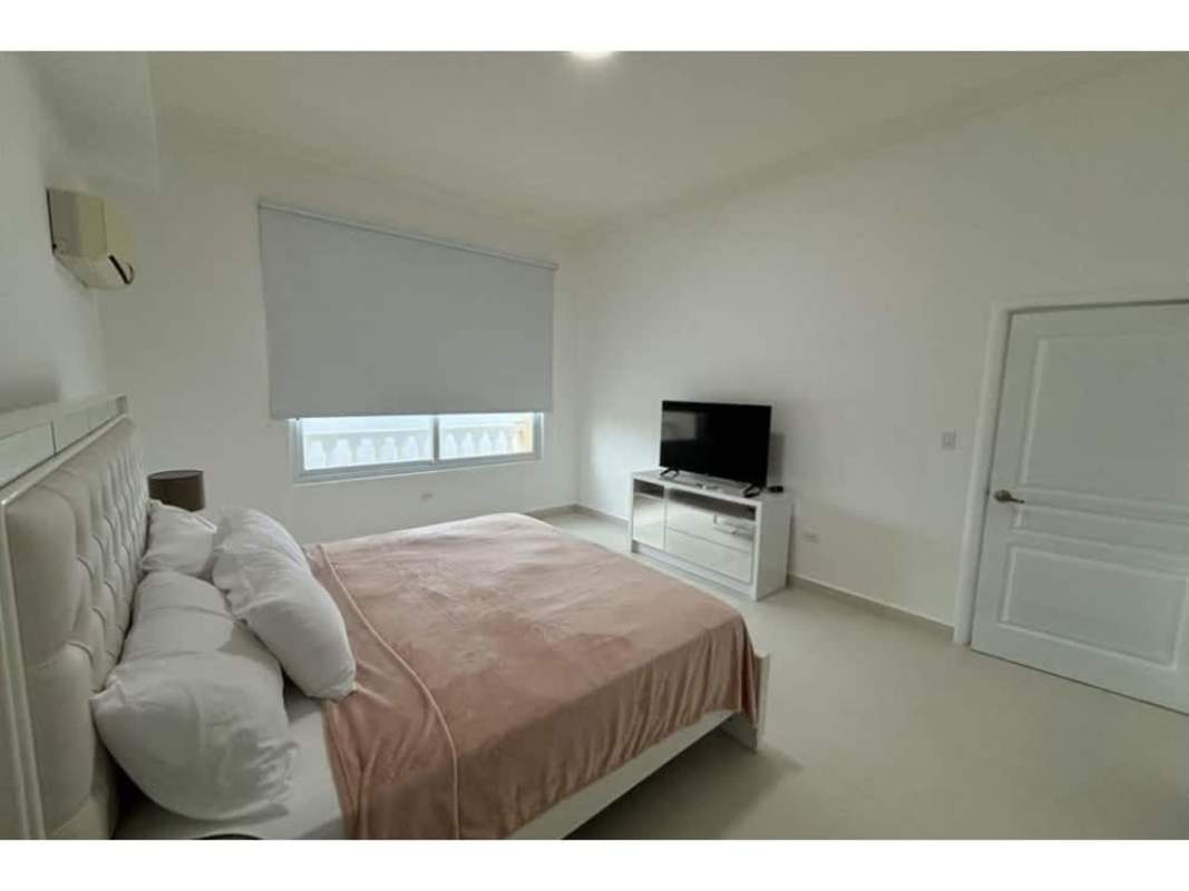 Contemporary bathroom with glass enclosed shower and marble vanity at Vista del Mar Panama
