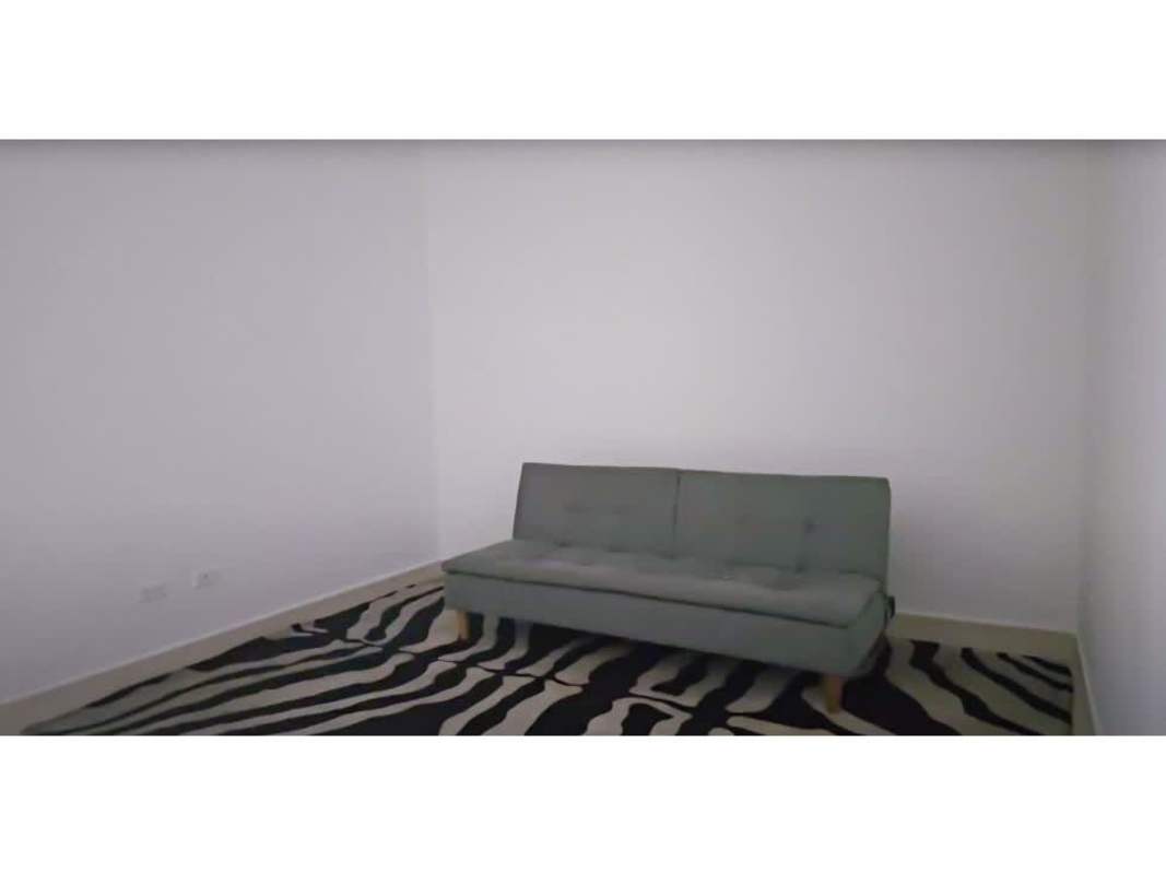 Minimalist open kitchen with dining space and window view in PH White apartment Panama