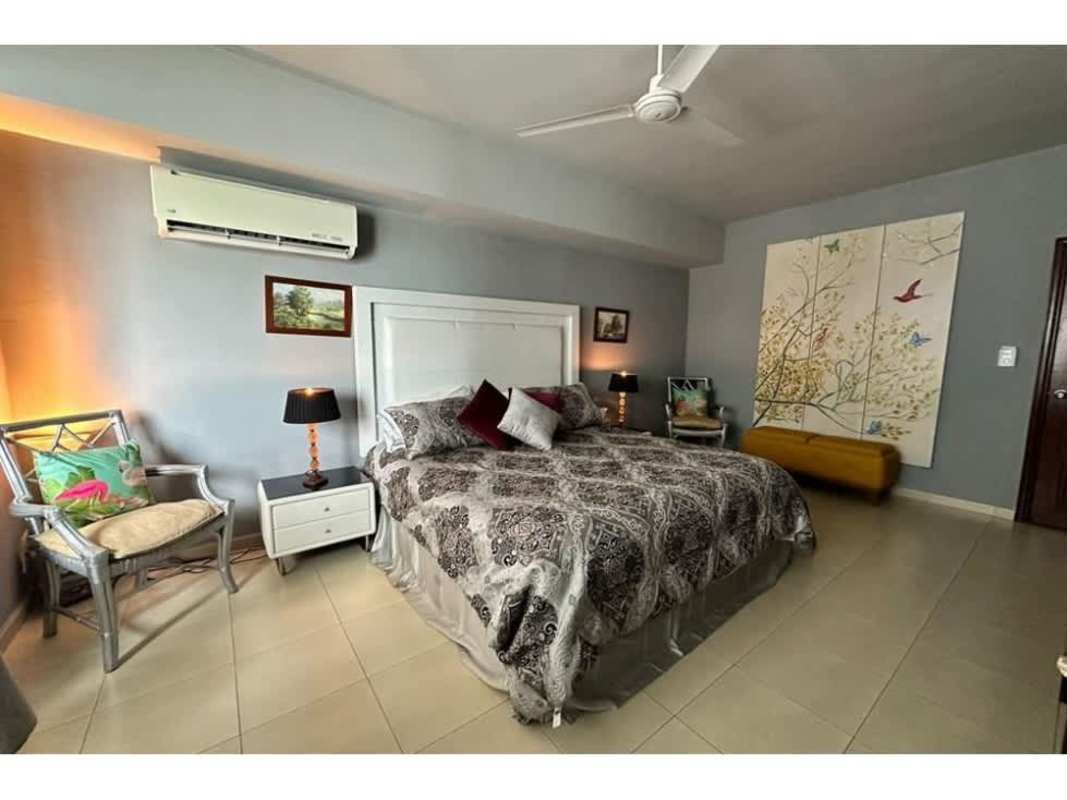 Modern living room with large windows offering ocean views at Grand Bay Tower Panama City