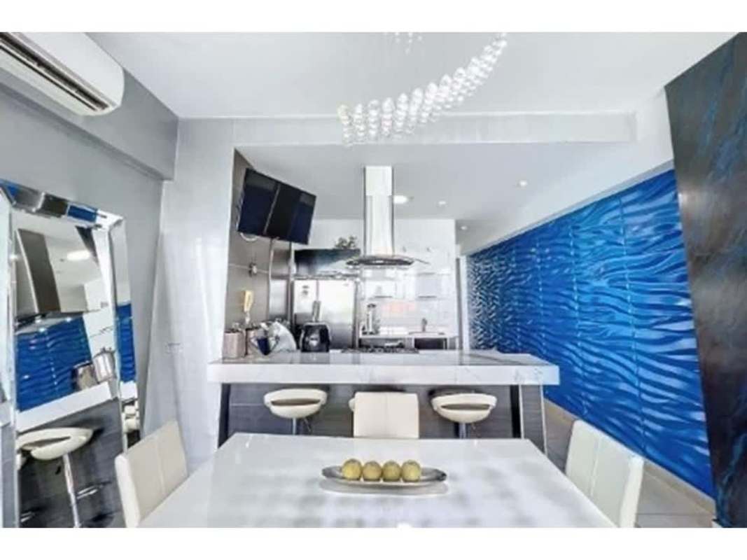Contemporary kitchen with marble countertops, appliances and breakfast bar in PH Element on Avenida Balboa Panama