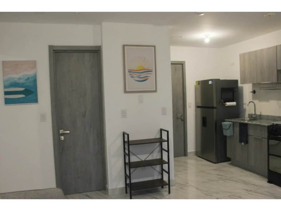 Modern furnished bedroom with AC, closet, ensuite bath, and city view at PH The Gray Bella Vista Panama