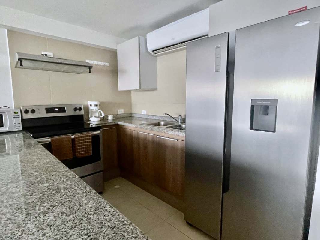 Living dining room modern open layout sliding doors ocean view terrace PH Amador Marina Panama