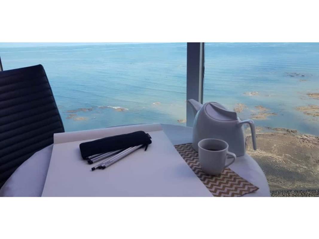 Spacious bright living room with floor-to-ceiling windows and ocean views at PH Costa Pacifica Punta Pacifica Panama