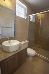Contemporary bathroom with glass shower, modern fixtures in house for sale Panama Oeste