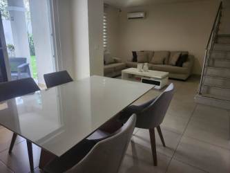 Contemporary L-shaped kitchen with gray cabinets in Bosques del Pacífico Panama Pacífico
