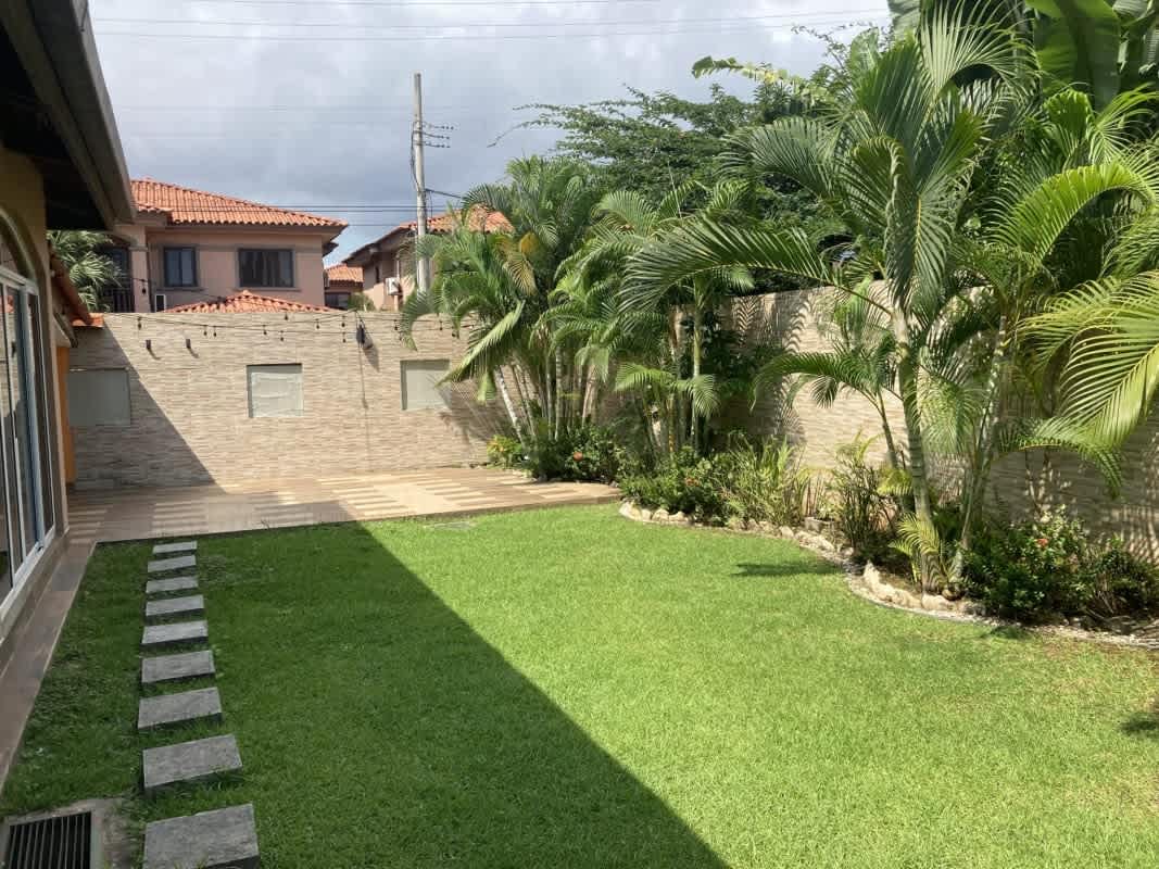 Living room with stylish decor, accent wall, large windows in Versalles Don Bosco Panama City