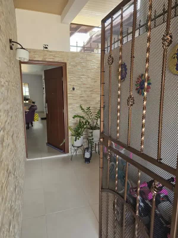 Bright living room with large window and tiled floors in Chanis Panama home