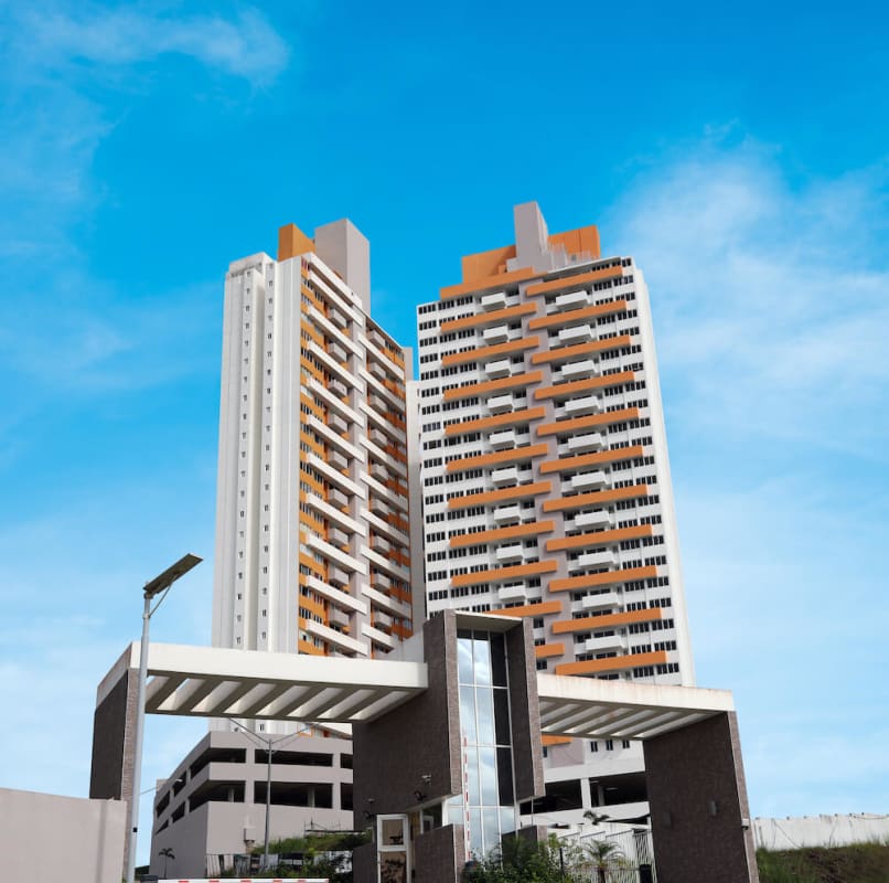 Bright entrance hall with white tiled floors leading to apartment rooms in PH El Crisol Panama