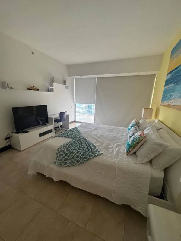 Open-plan kitchen dining area modern furniture luxury condo JW Marriott Punta Pacifica Panama