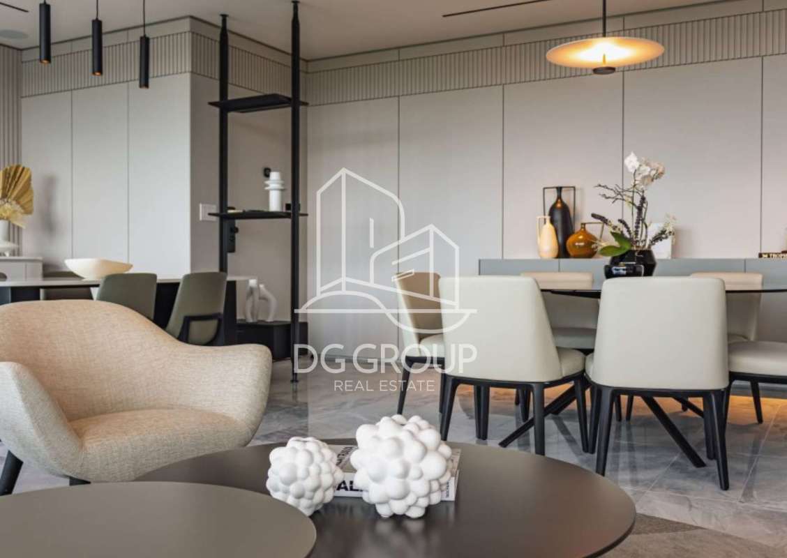 Contemporary kitchen with quartz counters and integrated appliances