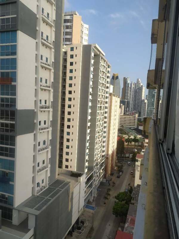 Kitchen with granite countertops, white cabinetry and gas stove in PH Del Rey Panama