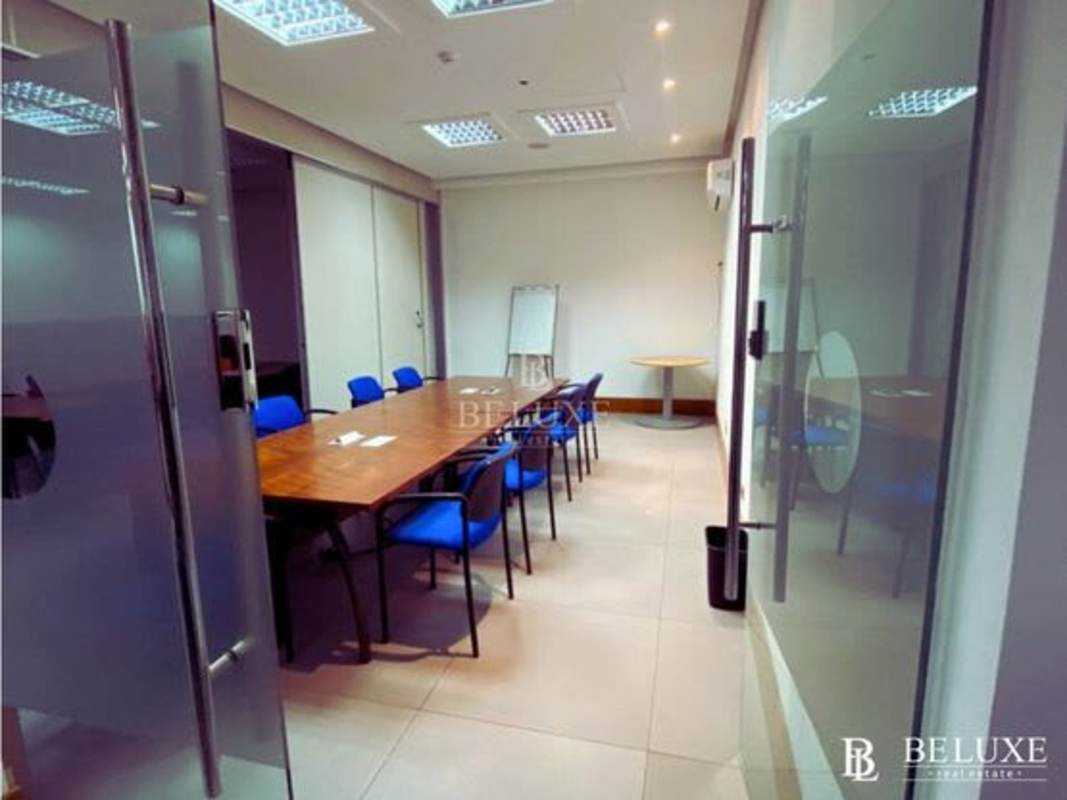 Large open workspace with cubicles and orange chairs PH Midtown Calle 50 Panama