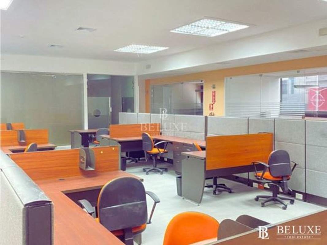 Glass enclosed meeting room with blue chairs PH Midtown Panama