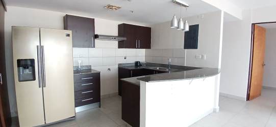 Resort-style swimming pool surrounded by gardens at PH Midrise Woodlands Panama Pacifico