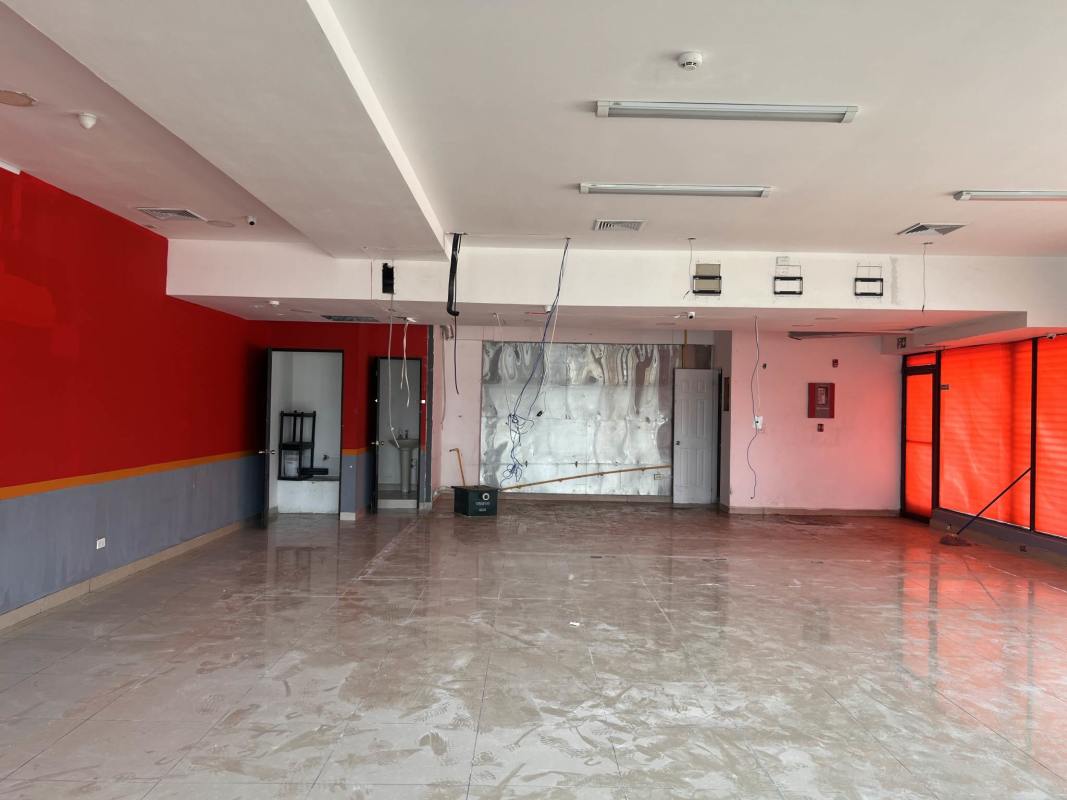 Retail unit with wide front glass windows and open interior at Los Pueblos Plaza