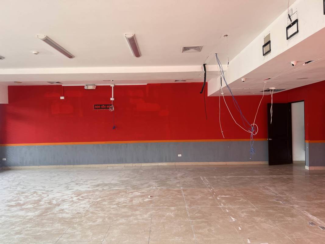 Open plan commercial rental interior with tile floor and exposed ceiling elements in Ciudad Radial Panama