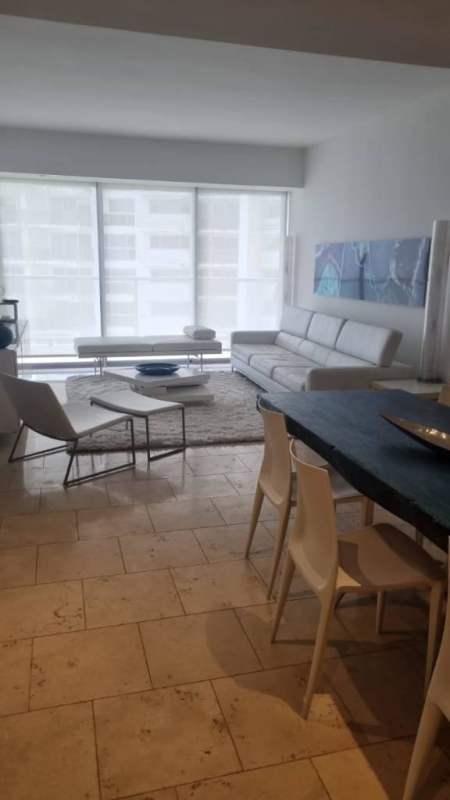 Bright modern living room with ocean view white sofa dining PH Ocean Club Panama