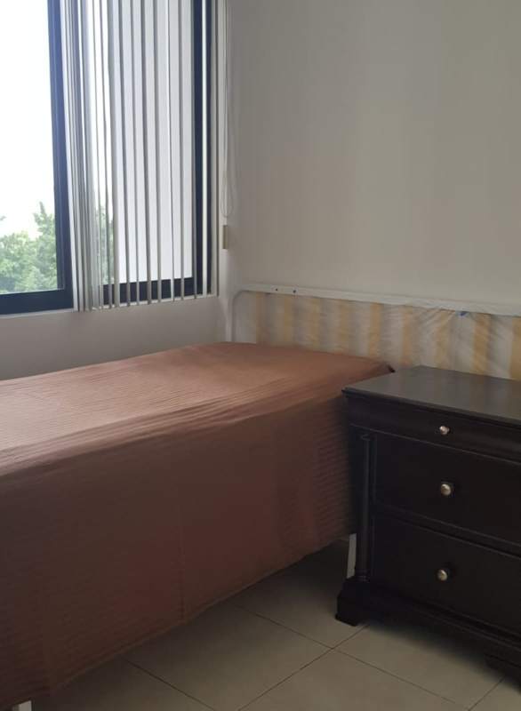 Bedroom with city view vertical blinds at PH Dos Mares Residences Panama