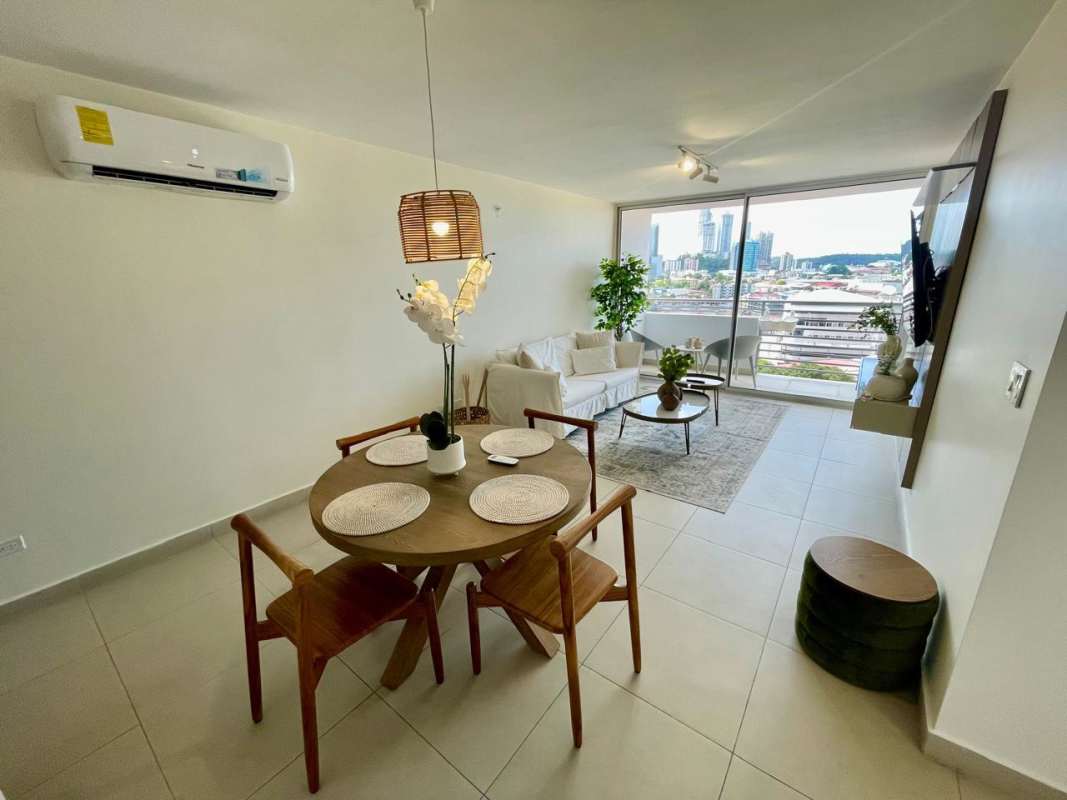 Open living dining area with balcony access at PH Scala El Carmen Panama City