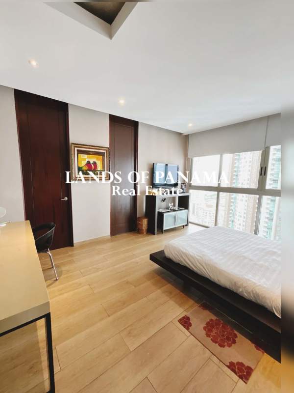 Furnished bedroom with city views, wood flooring, modern decor in PH Aqualina Punta Pacifica Panama
