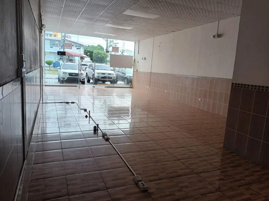Commercial interior with tiled floor and drop ceiling with lighting in Plaza Santafé Panama