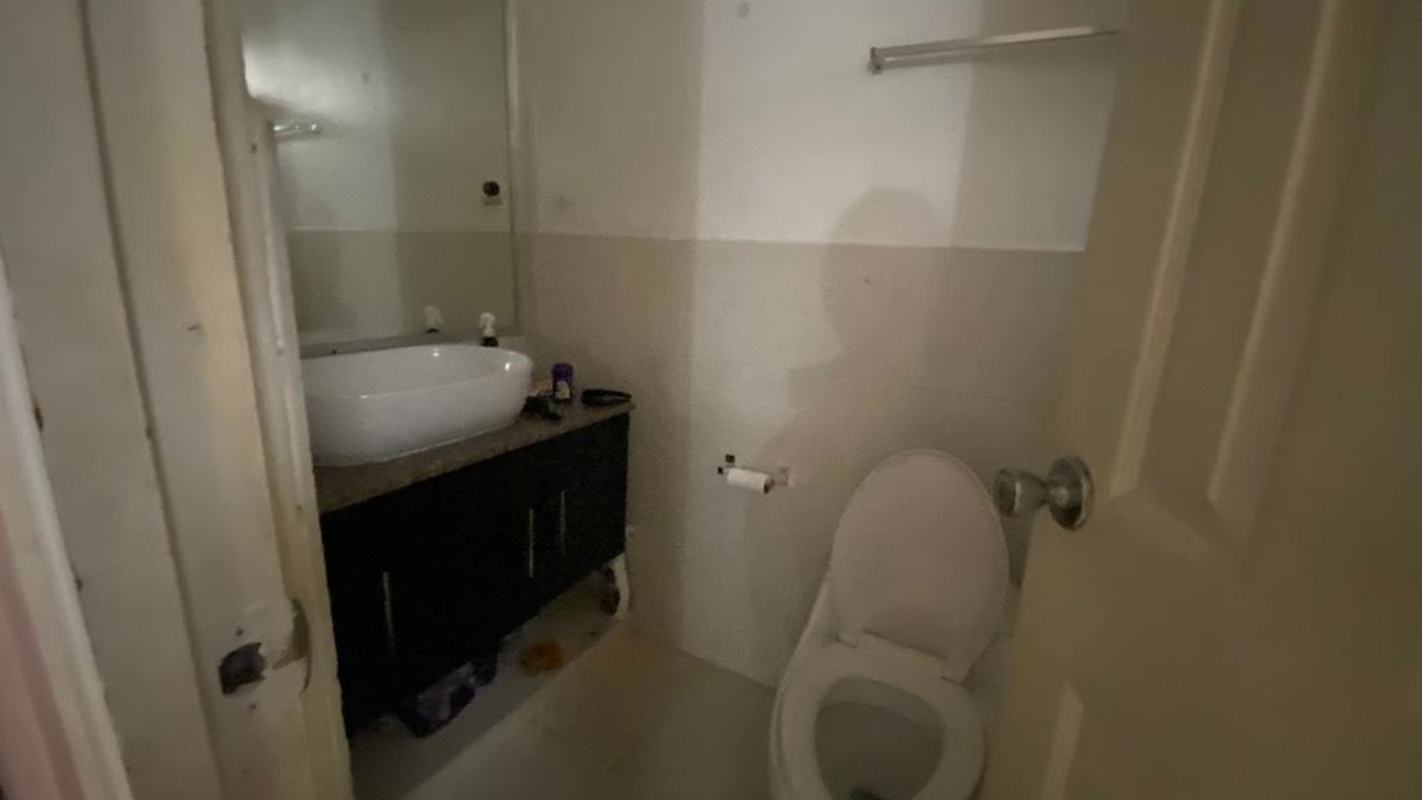 Compact bathroom with granite countertop, vessel sink and essential fixtures in Camino Real III Panama