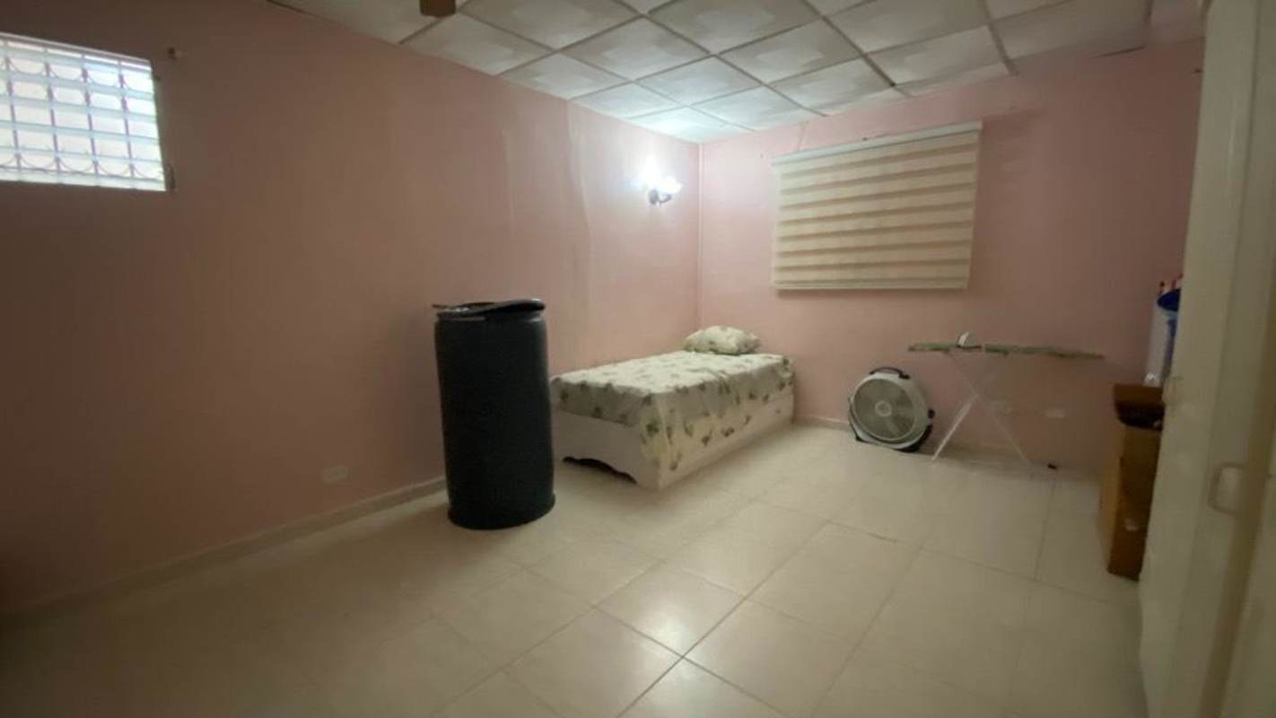 Bedroom with closet, pink walls, tiled floor, ceiling fan, residential rental Camino Real III Panama