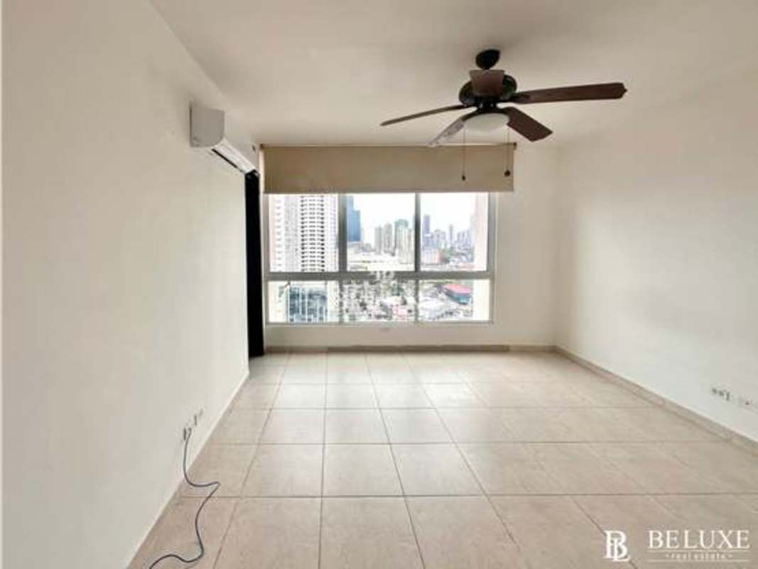 Spacious bedroom with built-in closets, marble floors and window at PH Emporium Tower Panama