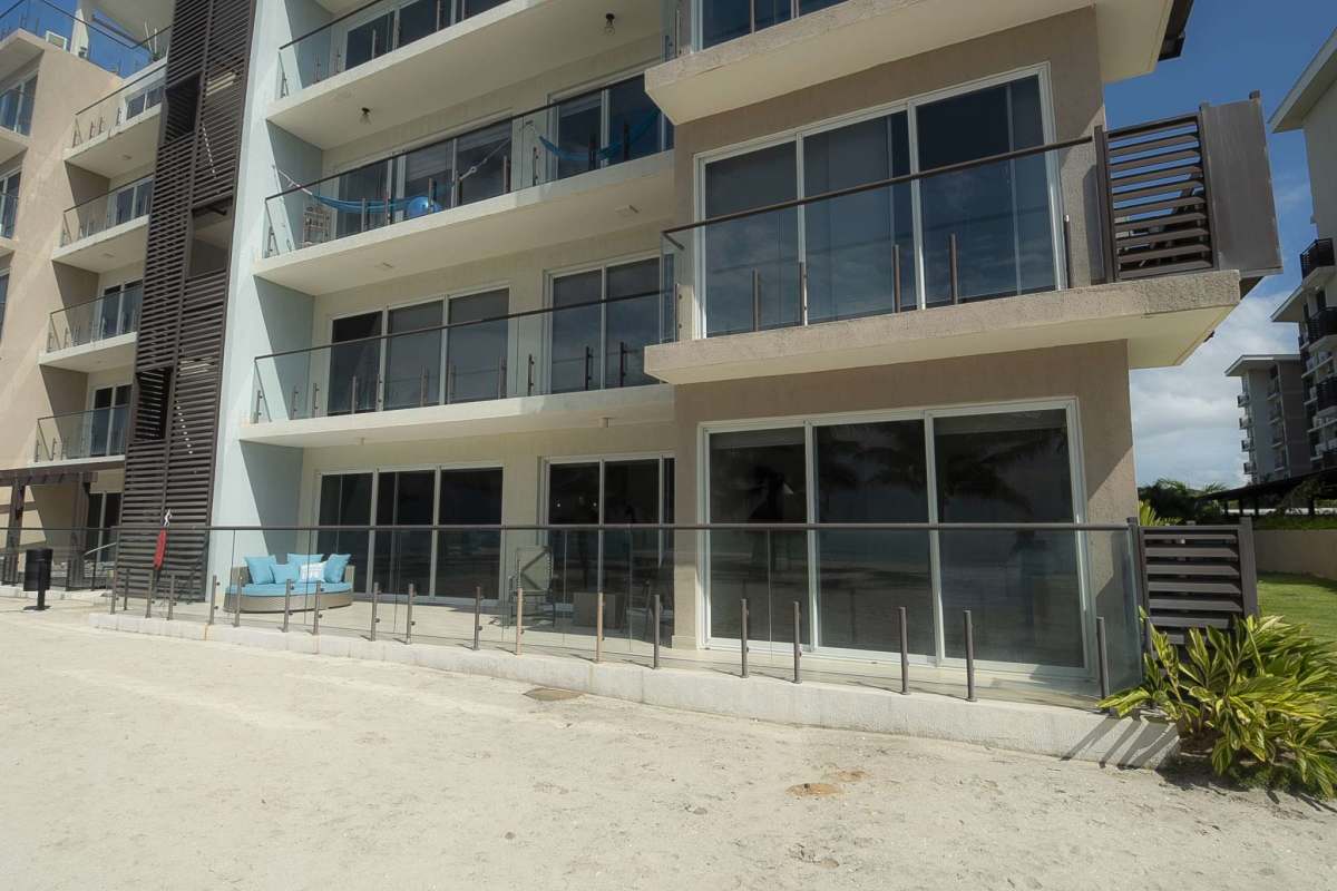 Beachside condominium complex with modern facade balconies and direct access beach at Punta Chame Olas del Mar