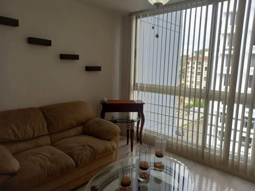 Bright living room with ceramic floors, large window, ceiling fan at PH Altavista Garden Condado del Rey Panama