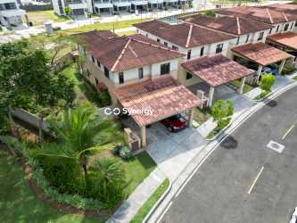Facade with covered parking of duplex home in Panama Pacifico gated community for sale