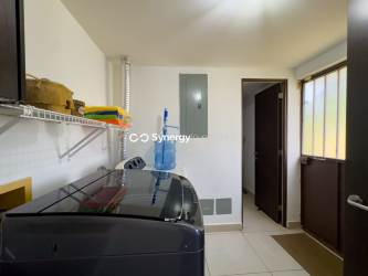 Kitchen with granite countertops, wood cabinetry, and modern appliances Panama Pacifico duplex for sale