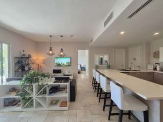 Spacious open-concept living and kitchen area in PH Puntarenas Buenaventura beach apartment