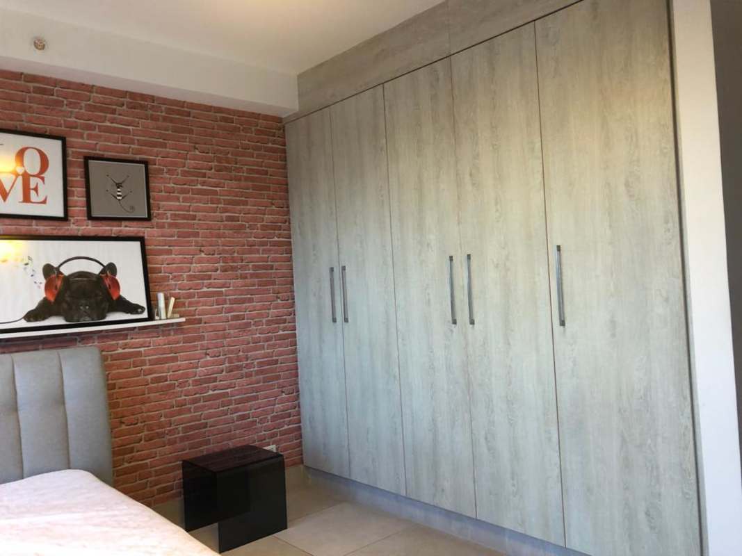 Bright open concept dining area and kitchen in Dos Mares apartment Panama City