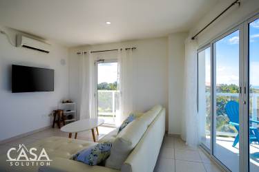 Bright living and dining space facing ocean with large windows Las Olas Playa La Barqueta Panama