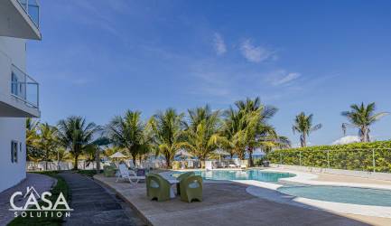 Palm trees poolside beachfront condominium with ocean view Las Olas Playa La Barqueta Panama