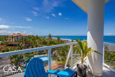 Aerial beachfront view of Las Olas Tower swimming pool tropical gardens Pacific Ocean Playa La Barqueta Panama