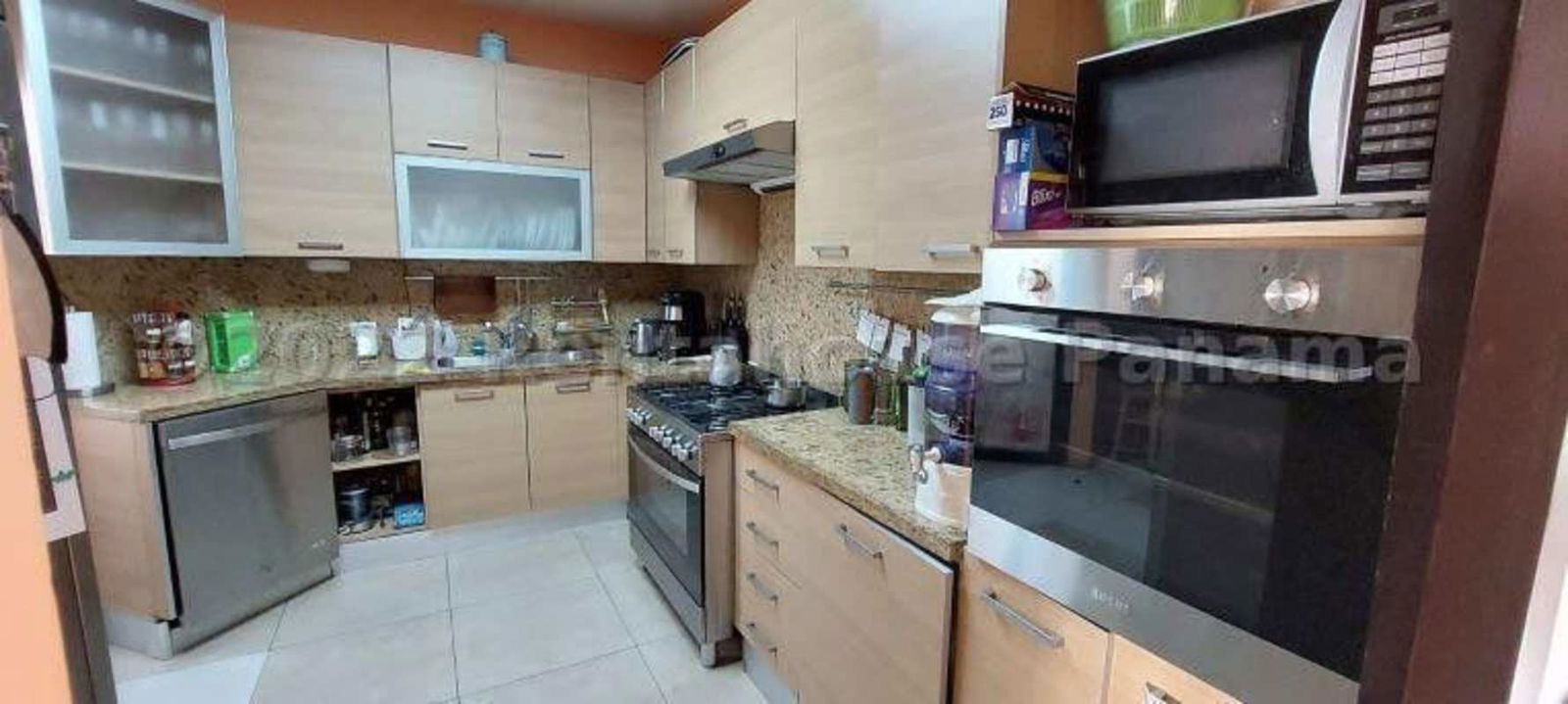 Dining room with large windows, seating for eight, scenic views at PH Albrook Residences Albrook Panama