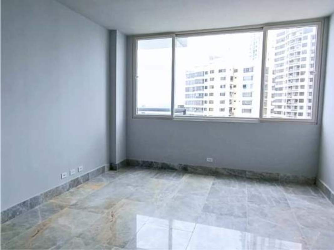 Elegant bathroom with marble tile and glass shower PH The Towers Panama luxury apartment