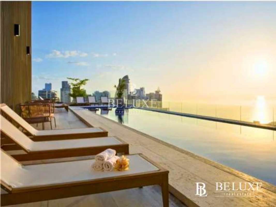 Infinity pool with sunset skyline ocean views PH The Towers Paitilla Panama