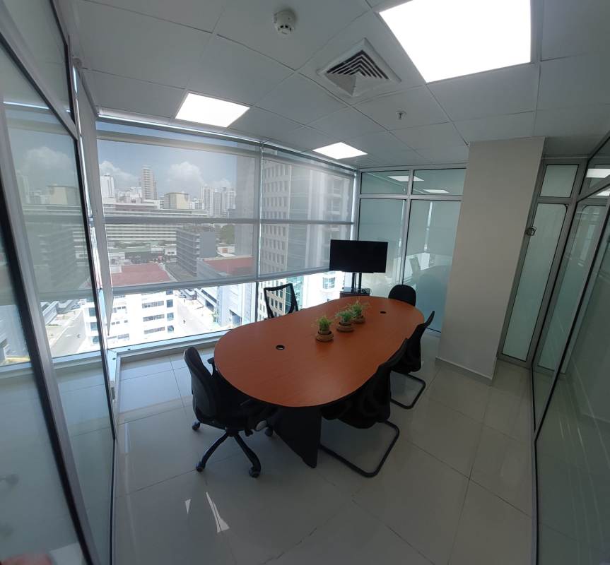 Glass-walled meeting room with conference table and chairs in PH BICSA Obarrio Panama City